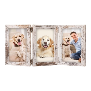 Detail of white vintage triple folding wooden picture frame with rustic worn texture