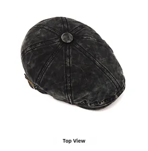 Top view of vintage washed charcoal denim beret showing stitching and top button detail