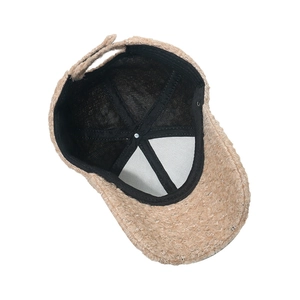 Detail view of the plush baseball cap's inner lining with adjustable strap and stitching