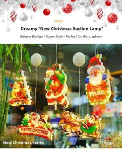 Close-up of LED Christmas suction cup lights with Santa and Reindeer on glass