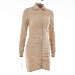 Detailed view of beige bodycon dress with lapel collar, buttons, and ruched details