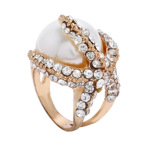 Statement gold starfish ring with a large central pearl and sparkling crystal accents