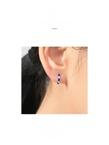 Close-up of S925 silver hoop earrings with dark blue enamel and cubic zirconia stones