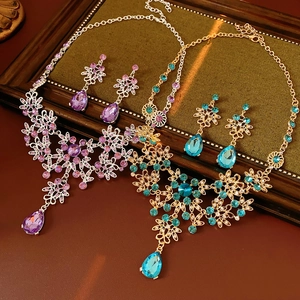 Detail view of vintage flower jewelry sets with sparkling crystals and teardrop pendants
