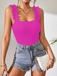 Detail of pink ribbed knit bodysuit with ruffled shoulder straps and slim fit design