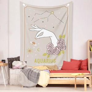 Close-up of Bohemian Aquarius tapestry featuring floral motifs and golden celestial icons
