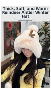 Detail of plush beige earflap hat with cute brown antlers and thick faux fur trim