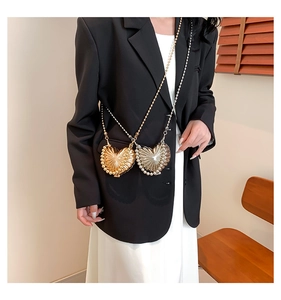Mini heart-shaped metal bags in gold and silver finish with pleated texture and chain straps