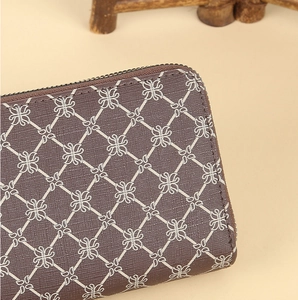 Detailed close-up of stitching and cross-texture on coffee floral long zipper wallet