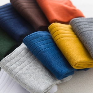 Breathable cotton crew socks in multiple colors with ribbed knit texture for men