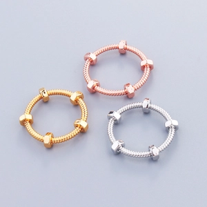 Three-piece set of nut-shaped industrial rings in gold, silver, and rose gold finishes