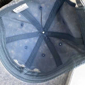 Detail view of cotton corduroy baseball cap interior with sweatband and seam tape