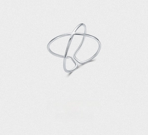 Detailed view of s925 silver X-shaped cross ring with minimalist geometric hollow design