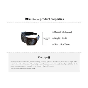 Detailed view of paisley fabric headband with wood accents and size measurements