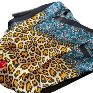 Leopard and floral print silk scarf with black borders for sun protection and styling