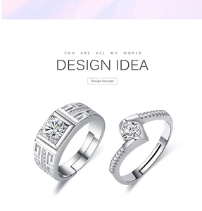 Detail of adjustable couple rings with geometric patterns and sparkling inlaid stones
