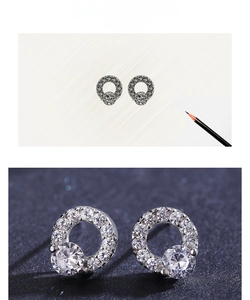 Macro detail of S925 sterling silver round halo stud earrings with cubic zirconia