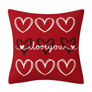 Red linen Valentines pillow with black and white heart prints and i love you text