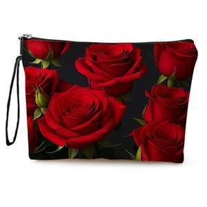 Floral makeup bag with red rose prints on black canvas featuring a secure wrist strap