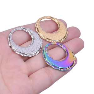Textured irregular oval stainless steel pendants in silver gold and rainbow plating