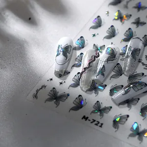 Vista macro degli adesivi per unghie a farfalla laser M-721 con effetti glitter aurora