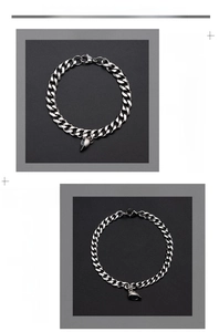 Detail of silver Cuban chain bracelets showing male and female sizes with magnetic heart