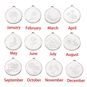 Detailed view of 12 mirror stainless steel birthday flower charms with month engravings
