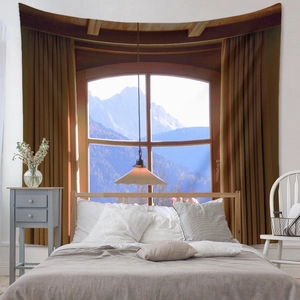 Detail of bohemian wall tapestry showing snow-capped mountain through a window frame