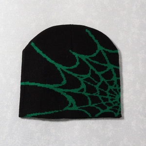 Detail view of high-quality knitted beanie with neon green spider web jacquard pattern