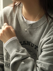 S925 sterling silver black heart pendant necklace and cross ring worn by a model