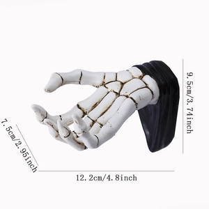 White skeleton hand wall hook in resin for keys and bags, dimensions 12.2x7.5x9.5cm