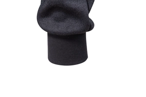 Detail showing the honeycomb knit texture and ribbed cuffs of the men's winter jacket