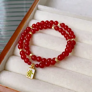 Double-layer red agate bead bracelet with golden charms and Mahjong tile pendant