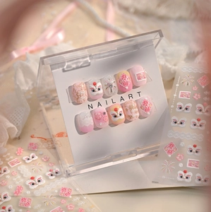Macro detail of 3D embossed pink lion dance nail art stickers with gold floral accents