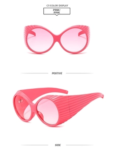 Pink Y2K oversized sunglasses detail view showing both front and side textured frame