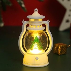 Macro shot of white vintage Christmas LED lantern featuring a green tree and warm light