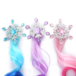 Three glittery snowflake hair clips with colorful gradient synthetic hair extensions