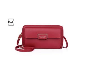 Detail of red faux leather crossbody phone bag with gold hardware and front flap pocket