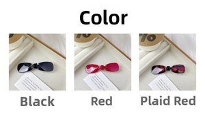Detailed view of bow hair clips in black, red, and plaid patterns in a display box