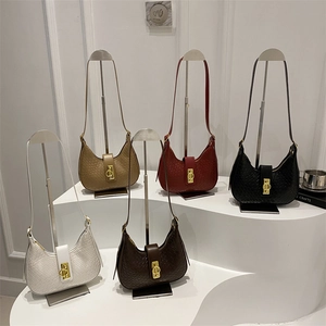 Hobo crescent bags with woven texture in five colors featuring metallic gold buckle accents