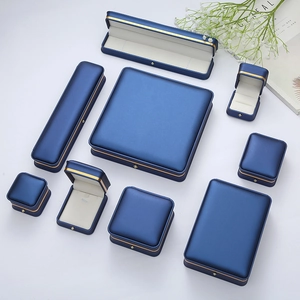 Premium navy blue jewelry gift box set with elegant gold trim and soft cream interior