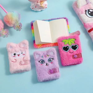 Detail of cute cartoon plush notebook showing soft embroidered fruit and cat covers
