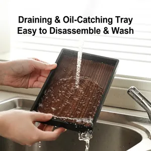 Kitchen lid and spoon holder tray with walnut texture being rinsed under running water