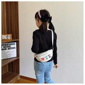White kids waist bag with colorful LOVE sequin embroidery and striped strap detail