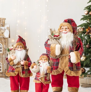 Three Nordic Santa Claus figures in red plaid outfits for festive Christmas home decor