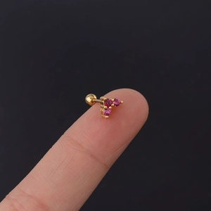 Macro shot of 20G stainless steel pink zircon heart stud with ball screw back on finger