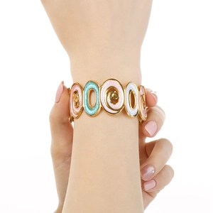 Golden titanium steel oval bangle with colorful enamel flowers and spiral texture