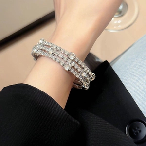 Close-up of a three-row sparkling rhinestone geometric cuff bracelet for women