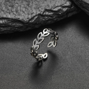 Adjustable silver olive leaf ring in minimalist stainless steel with an open band design