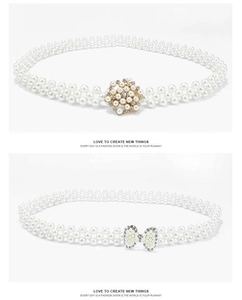 Detail of white pearl elastic belts featuring flower and bow buckles with crystals